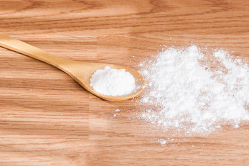 baking soda and lemon on wooden table