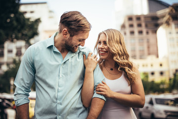 Happy couple walking on street