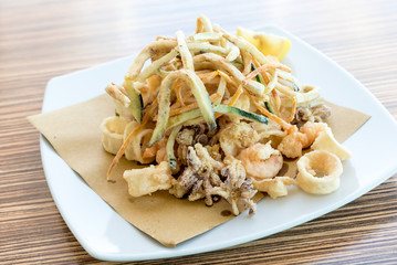 Fried mixed fish with lemon