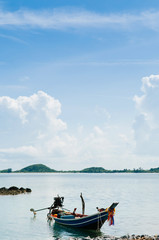 Thai Longtail Fishing Boat at Koh Tean near Samui island in summer day with blue sky