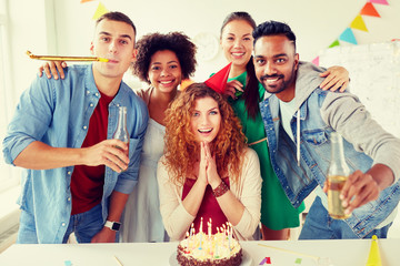 corporate and people concept - happy team of coworkers with non-alcoholic drinks and cake celebrating birthday at office party