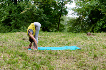 Young Woman Doing Yoga Meditation and Stretching Exercises