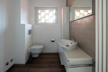 Fototapeta na wymiar Modern minimal bathroom with parquet
