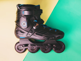 Roller skates on pastel flat lay background