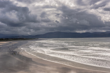 Scenic beach with reflections of the dramatic sky, Dingle Peninsula, Ireland
