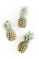 Pineapples isolated on white background. Food concept. Flat lay, top view