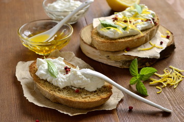 Lemon, basil, pink pepper, ricotta and honey bruschetta