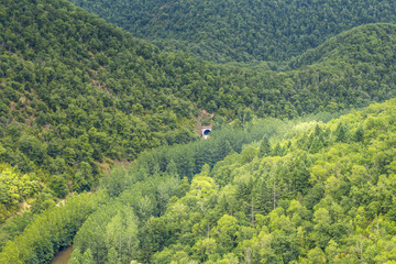 Railway tunnel in dense forests in the Aveyron, near Najac, France