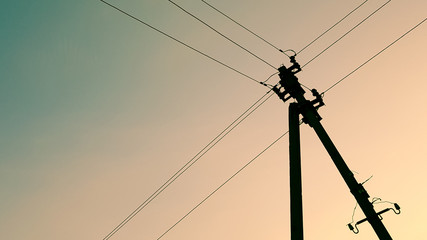 Fototapeta premium electric pole with twilight blue sky and white clouds