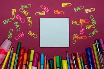 Adhesive note, pencils on colorful background, blank copy space