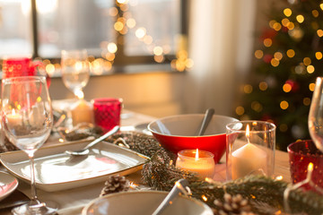 christmas, holidays and eating concept - table served for festive dinner at home