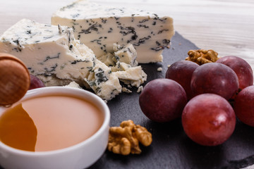 delicious blue cheese on wooden rustic background