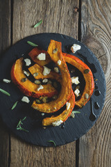 Baked pumpkin with cheese and herbs