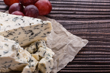 delicious blue cheese on wooden rustic background