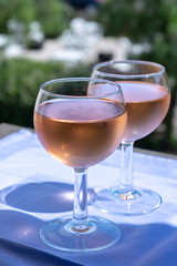Rose wine of Provence, France, served cold on outdoor terrace in two wine glasses
