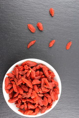 dried goji berries in a small white bowl