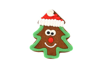 Christmas tree gingerbread figure with hat and smily.