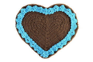 hand crochet Gingerbread heart shape valentines day gift with copy space on white isolated background.