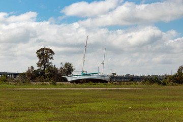 Fototapeta premium Sailboat Stranded by Hurricane Florence in New Bern, NC