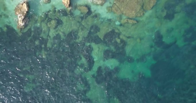 White pebble beach with crystal clear water in the Mediterranean sea, Elba Island (Italy)