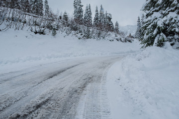 Winter road and snow with frost, Mountain road in winter snow,