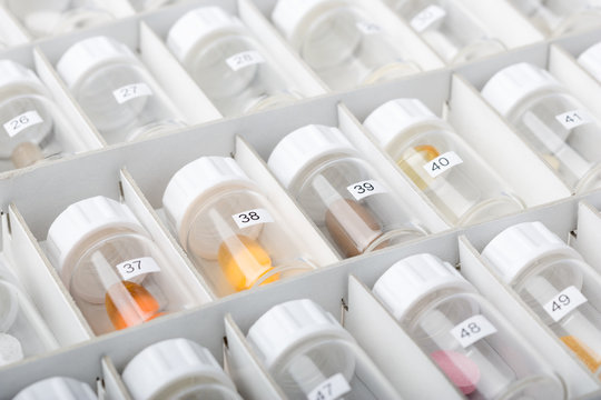 Colorful&nbsp;pills packed in plastic jars
