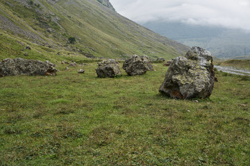 Mountain landscape, large stones lie in the gorge.