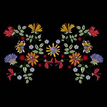 Embroidery symmetric pattern with ethnic flowers. Vector embroidered traditional floral design for fashion fabric.
