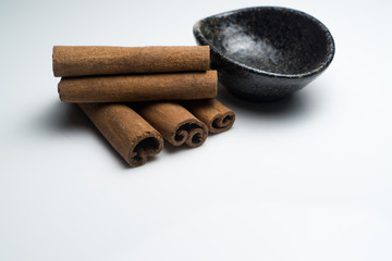 Cinnamon and Anise on white background isolated