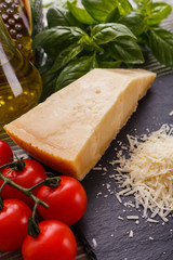 fragrant grated Parmesan on a slate stone slicing board