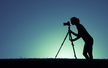 silhouette of photographer at sunset