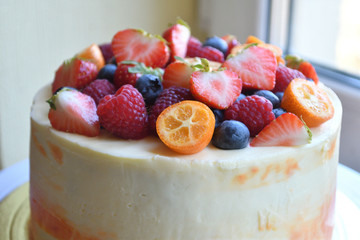 Cake with berries on top.