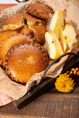 Round Dutch homemade cookies filled with apples and almonds nuts, autumn and winter seasonal dessert in Netherlands
