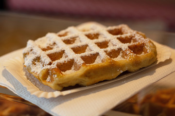 Fresh baked Belgian waffle with white sugar powder
