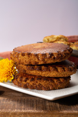 Round Dutch homemade cookies filled with marzipan and almonds nuts, autumn and winter seasonal dessert in Netherlands