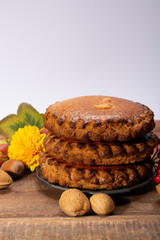 Round Dutch homemade cookies filled with marzipan and almonds nuts, autumn and winter seasonal dessert in Netherlands