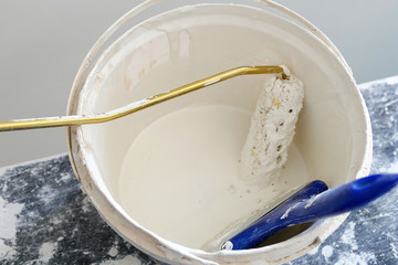of white paint bucket and brushes
white paint bucket and paint rollers and brush


