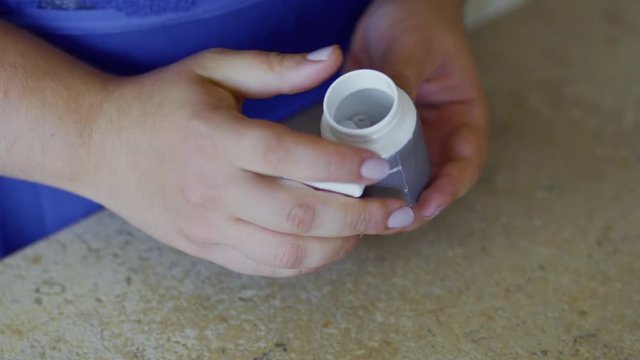 Fat girl holds pills in hands