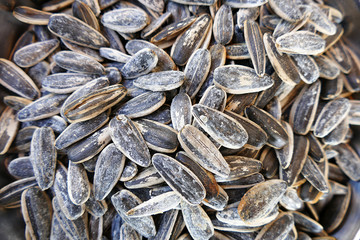 sunflower seeds in plates. People eat sunflower seeds,

