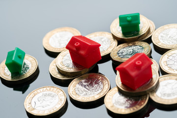Housing estate concept with coins in studio