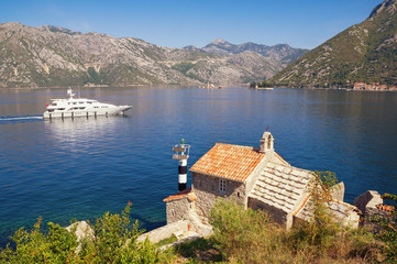 Fototapeta premium Beautiful Mediterranean landscape. Montenegro, Adriatic Sea. View of Bay of Kotor, Church of Our Lady of the Angels and two small islands (Our Lady of the Rocks and St. George)