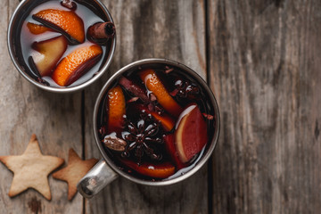 Mulled wine with apple, orange, cardamom, cinnamon, anise and honey. Served in metallic mugs....
