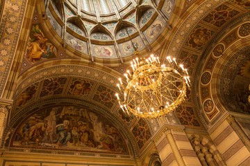 Fototapeta na wymiar Church, Golden classic church ceiling with a chandelier