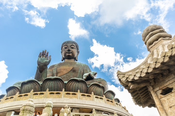 Fototapeta na wymiar Tian Tan Buddha, Big Budda, The enormous Tian Tan Buddha at Po Lin Monastery in Hong Kong. The world's tallest outdoor seated bronze Buddha located in Ngong ping 360.