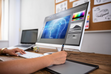 Female Designer Working On Computer