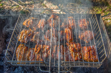 Cooking barbecue outdoors. Man cooking meat on grill
