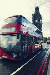 Foto op Canvas Big Ben Under Conservation Works and Red double decker bus in motion on Westminster Bridge. London, England, United Kingdom © Dmitry Pistrov