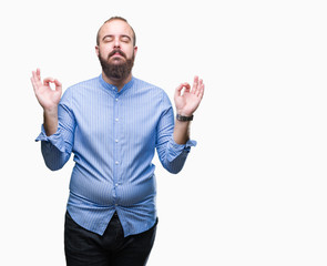 Young caucasian hipster man over isolated background relax and smiling with eyes closed doing meditation gesture with fingers. Yoga concept.