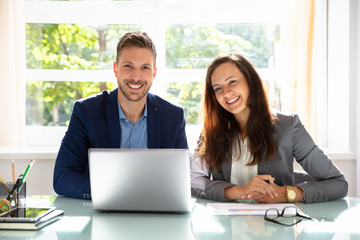 Portrait Of Two Happy Businesspeople