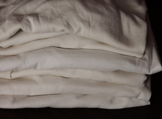 Pile of folded white shirts